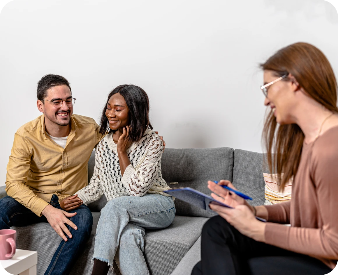 Couple in therapy session with counselor.