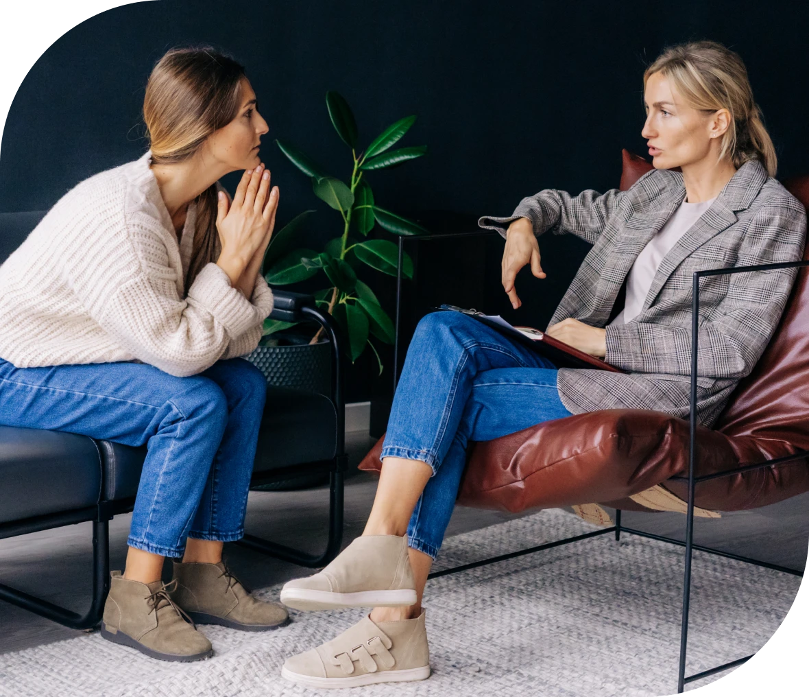 Two women having a serious conversation.